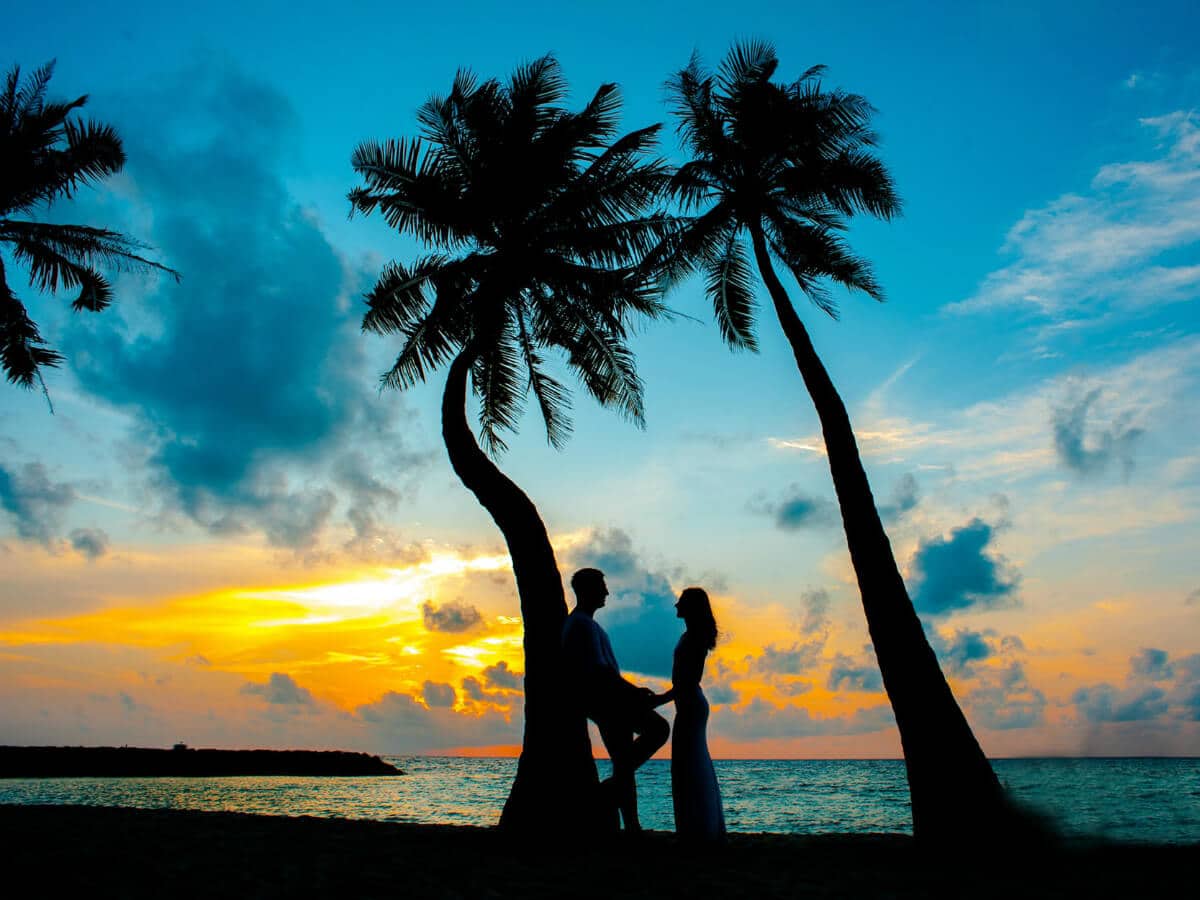 Romantic beach couple photo in Kerala honeymoon tour package by ATW Travels